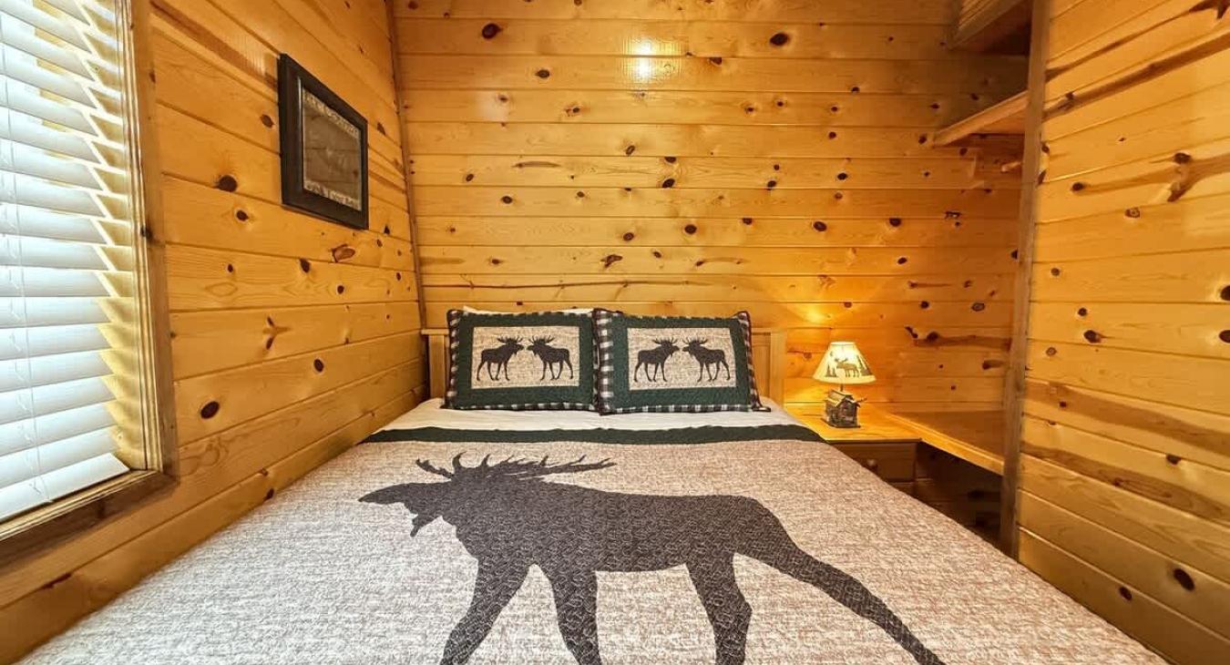 second bedroom with queen and small closet space