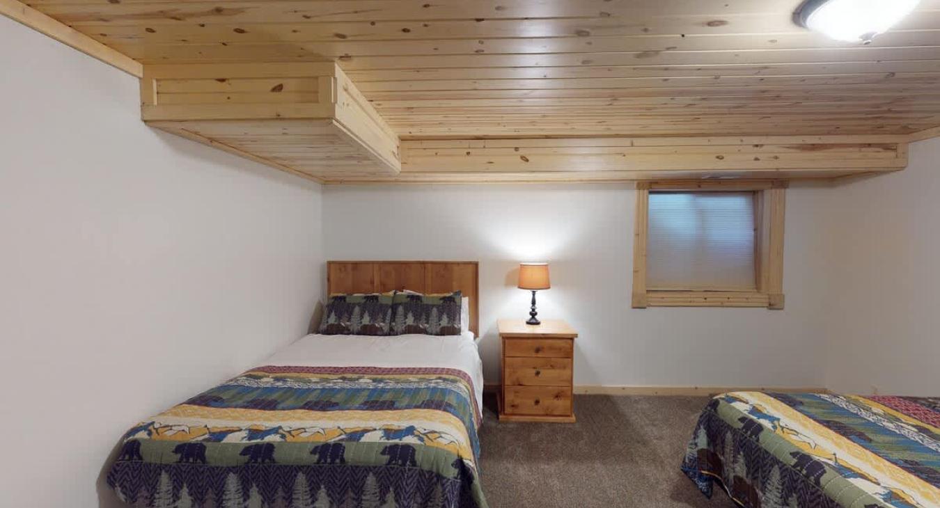 Bedroom #7 located downstairs with 2 Queen beds.