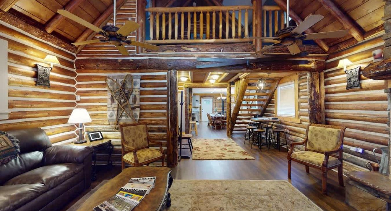 Open living room with seating and propane fireplace.