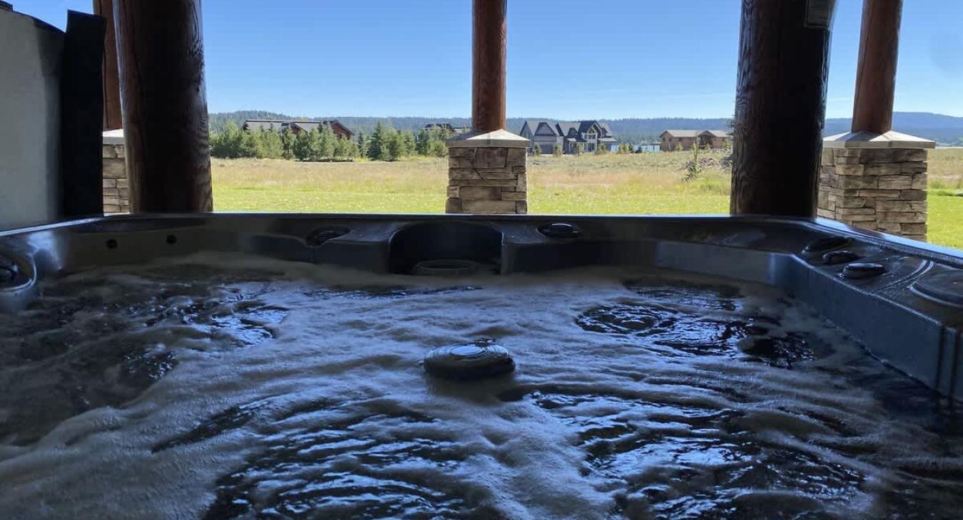 Large hot tub overlooking the beautiful landscape.