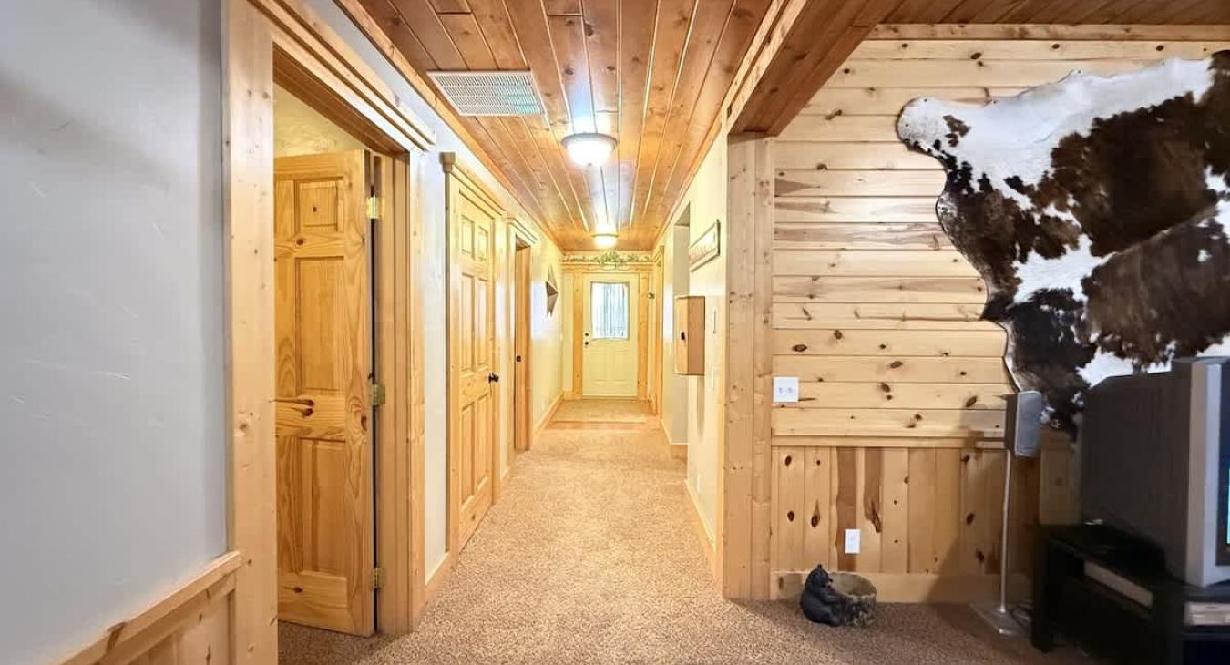 Downstairs hallway to access all the rooms and shared bathroom.