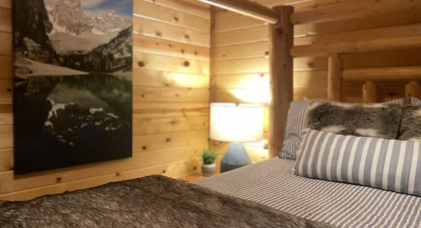 The lighting is soft and inviting, with overhead lighting in the ceiling and a few decorative touches that add character to the room.