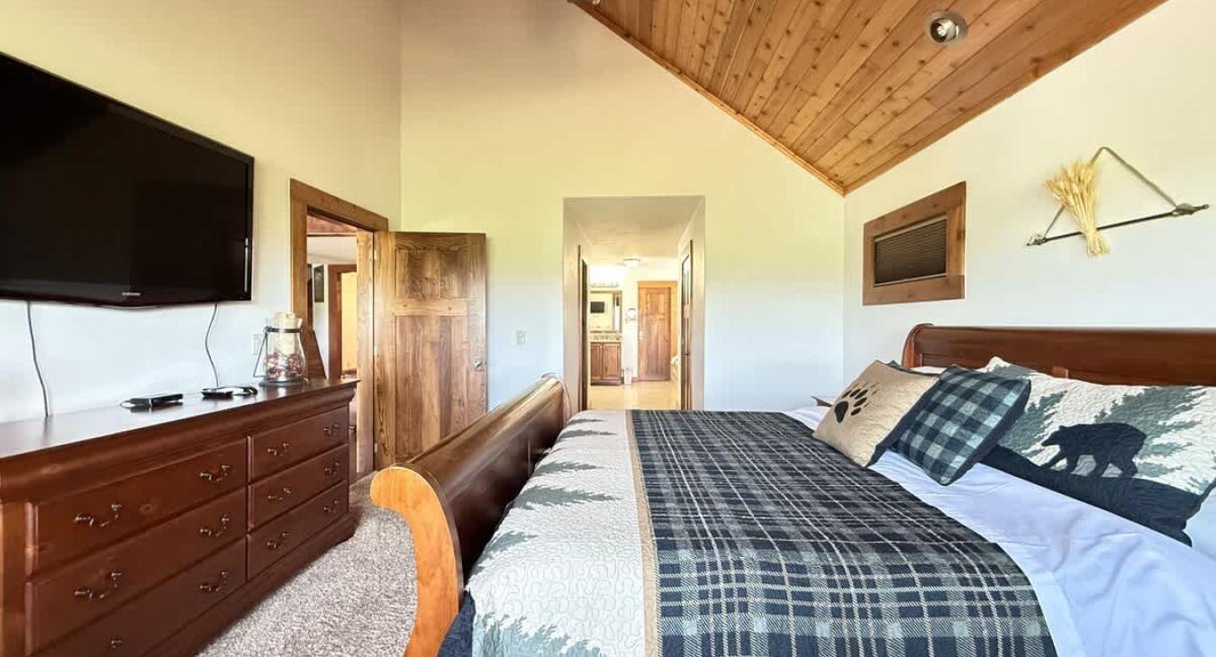 Master bedroom located on the main level with a King size bed.