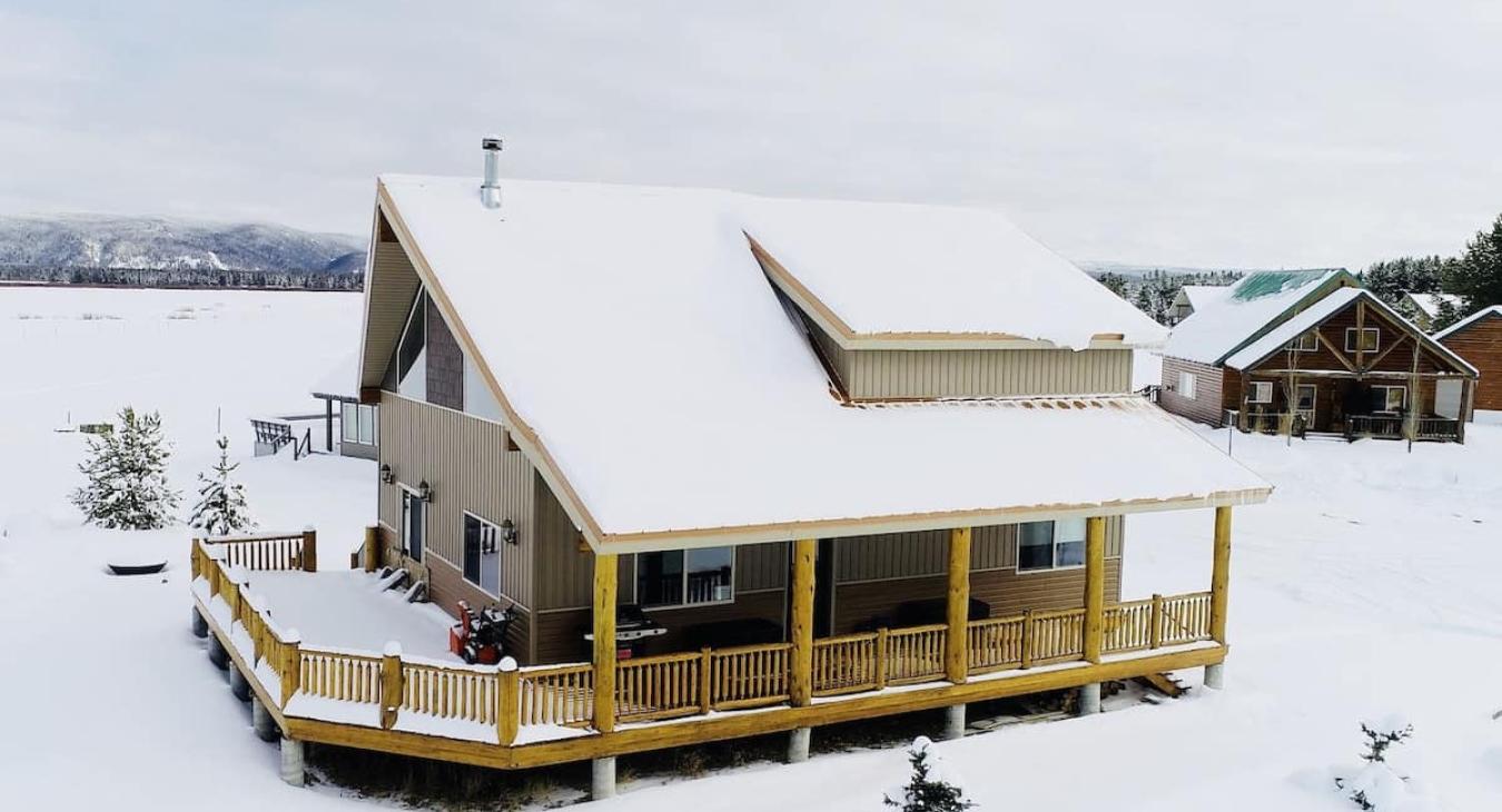 Aerial view of the outside of the cabin in the winter.
