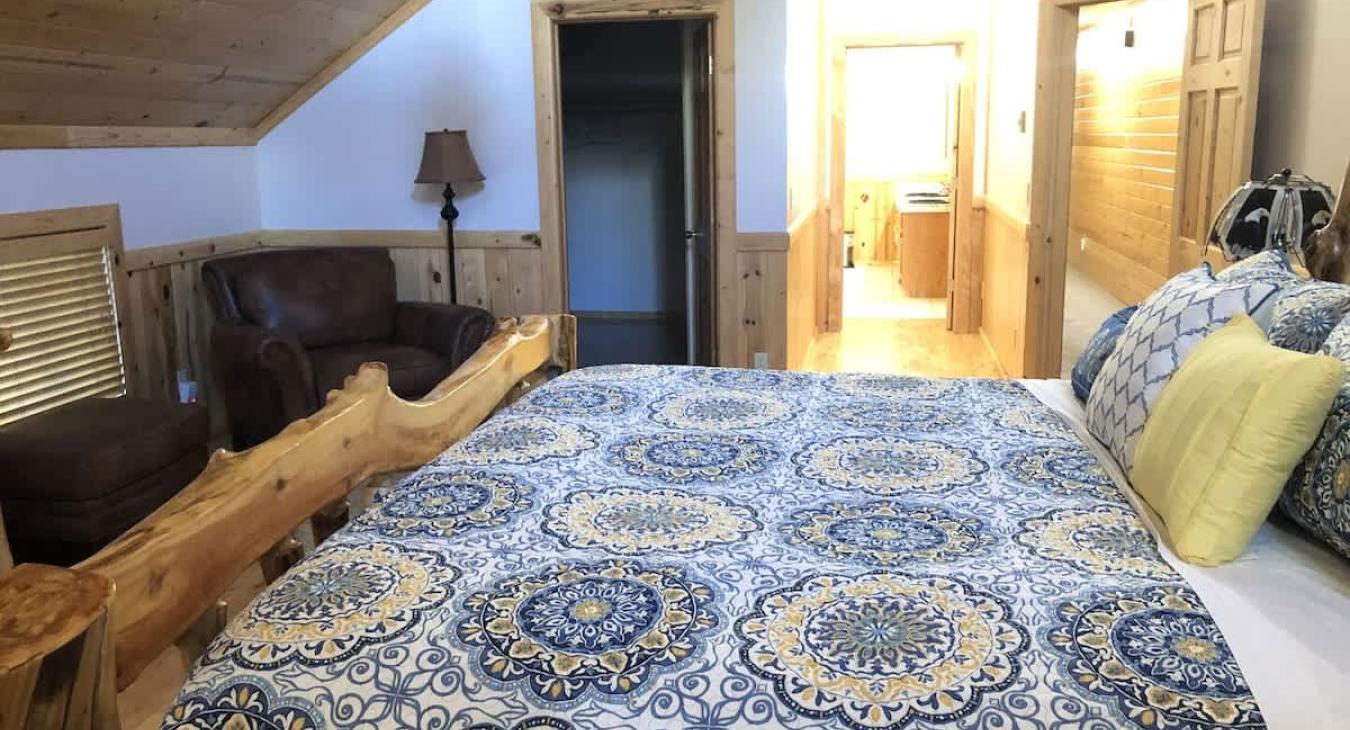 Master bedroom located upstairs with a King size bed and an ensuite bathroom.