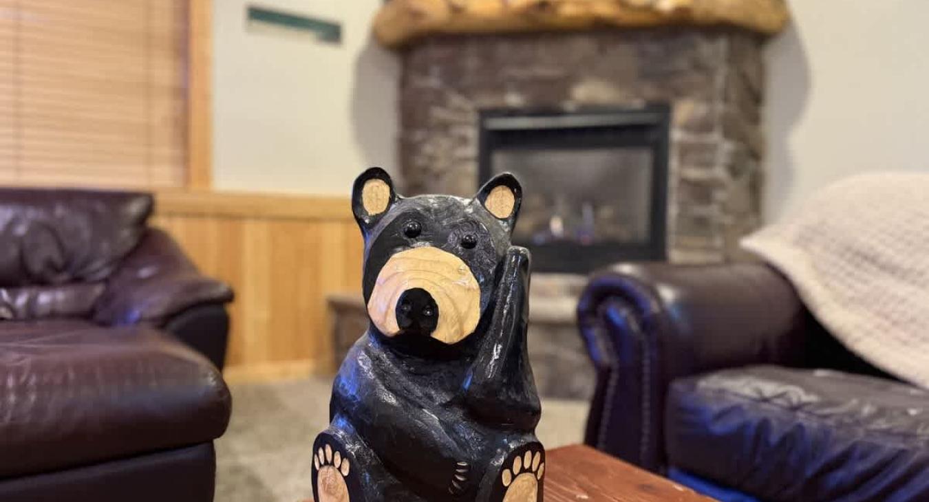 This cabin has much bear decor that offers a unique rustic charm.