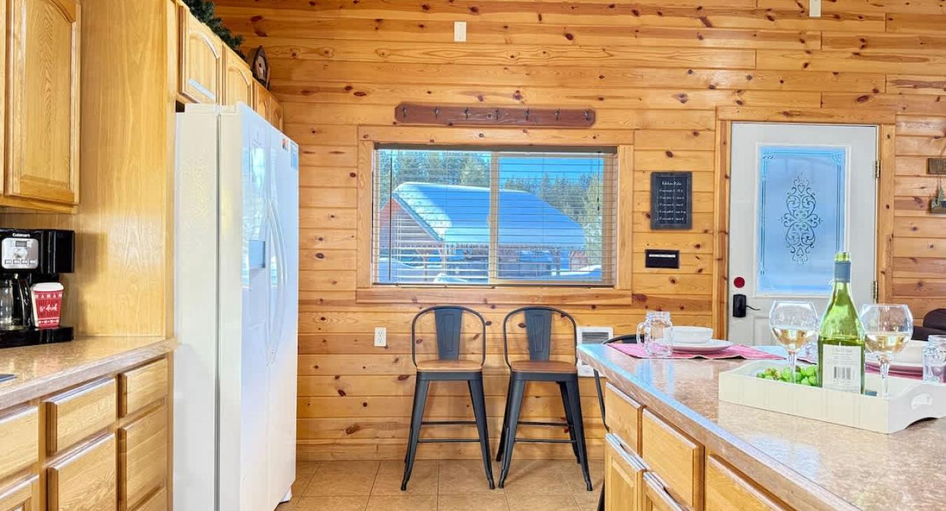 The open layout of the kitchen blends seamlessly into the other areas of the cabin.