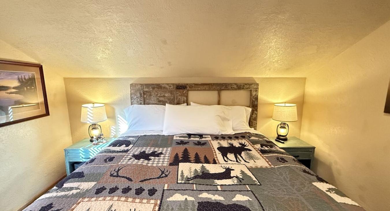 Upstairs bedroom with queen bed to comfortably sleep 2 people.