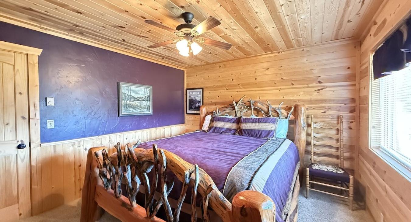 Downstairs second bedroom with a king bed.