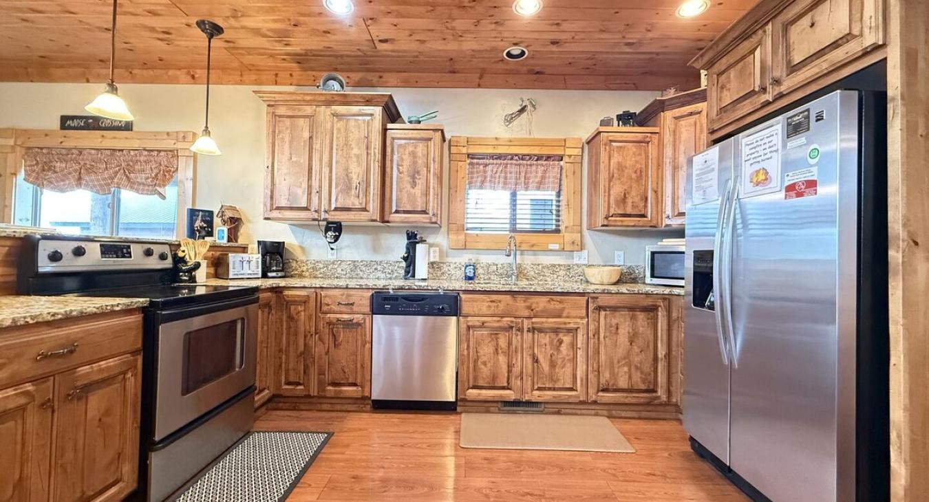 Equipped with dishes, silverware,  pots and pans, and basic cooking essentials.