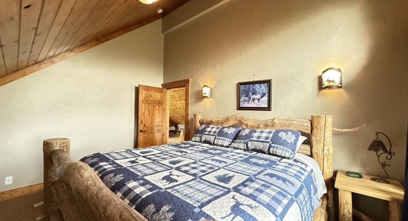 Bedroom #2 located upstairs with a King size bed.