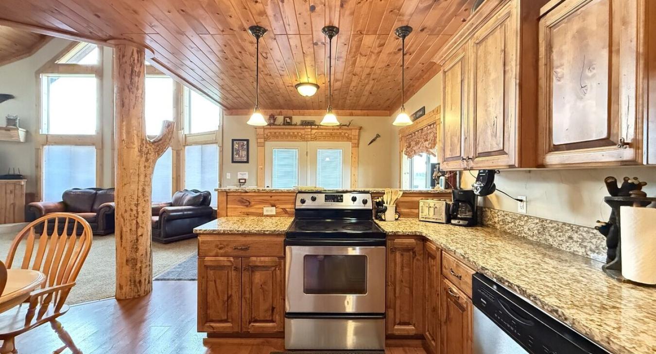 Beautiful open kitchen with stainless steel appliances.