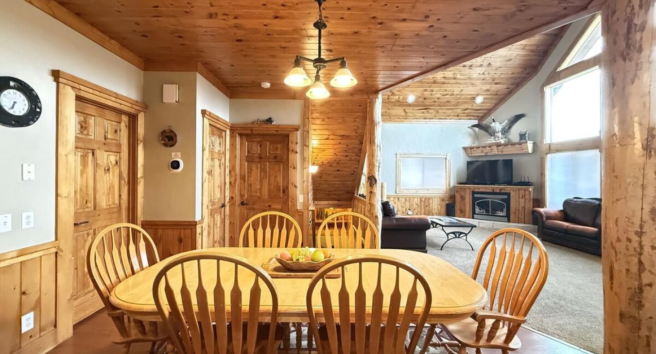 2nd Dining table seats 6 people with additional seating at the kitchen island.