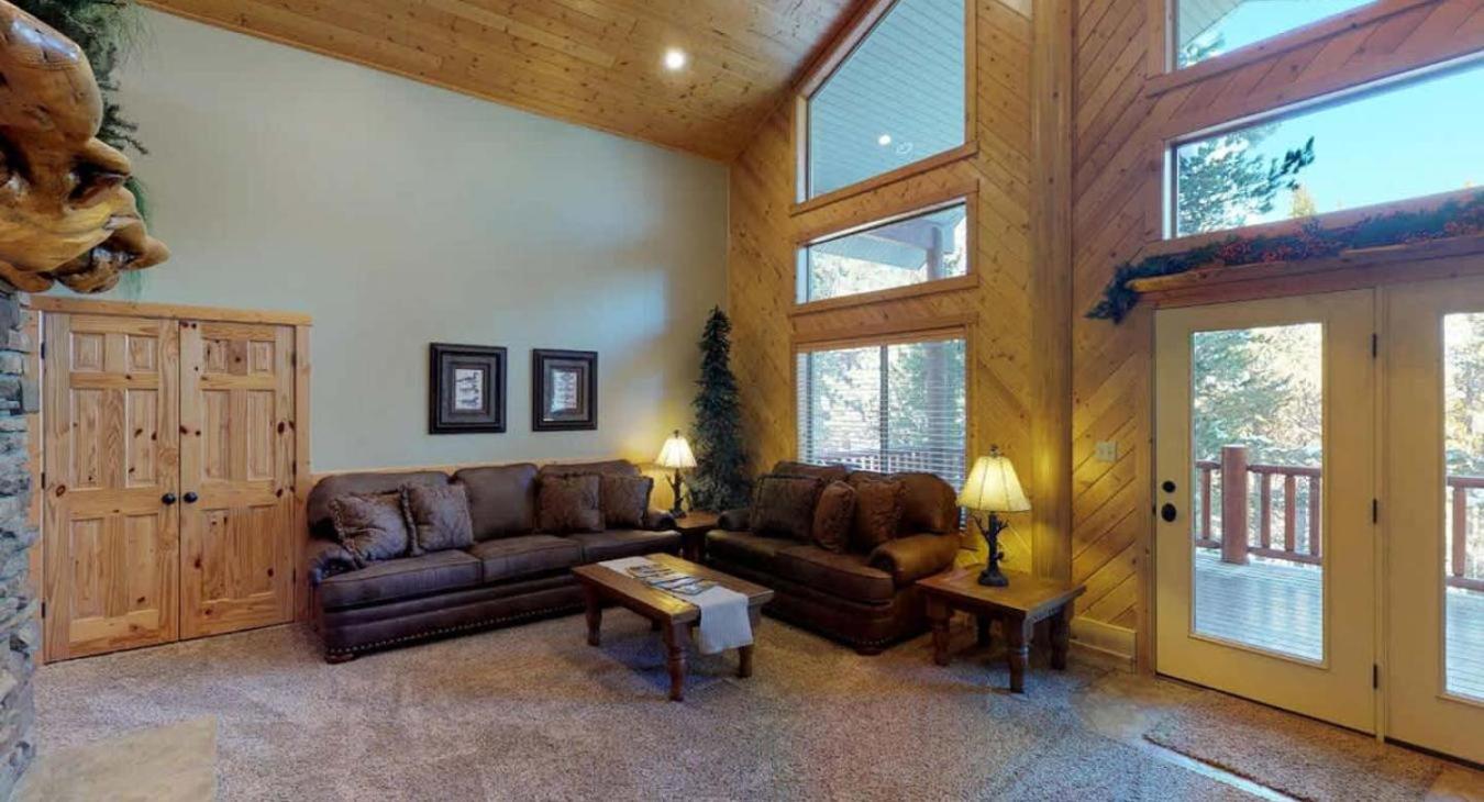 Living room is set up with lots of seating for everyone to relax during your stay.