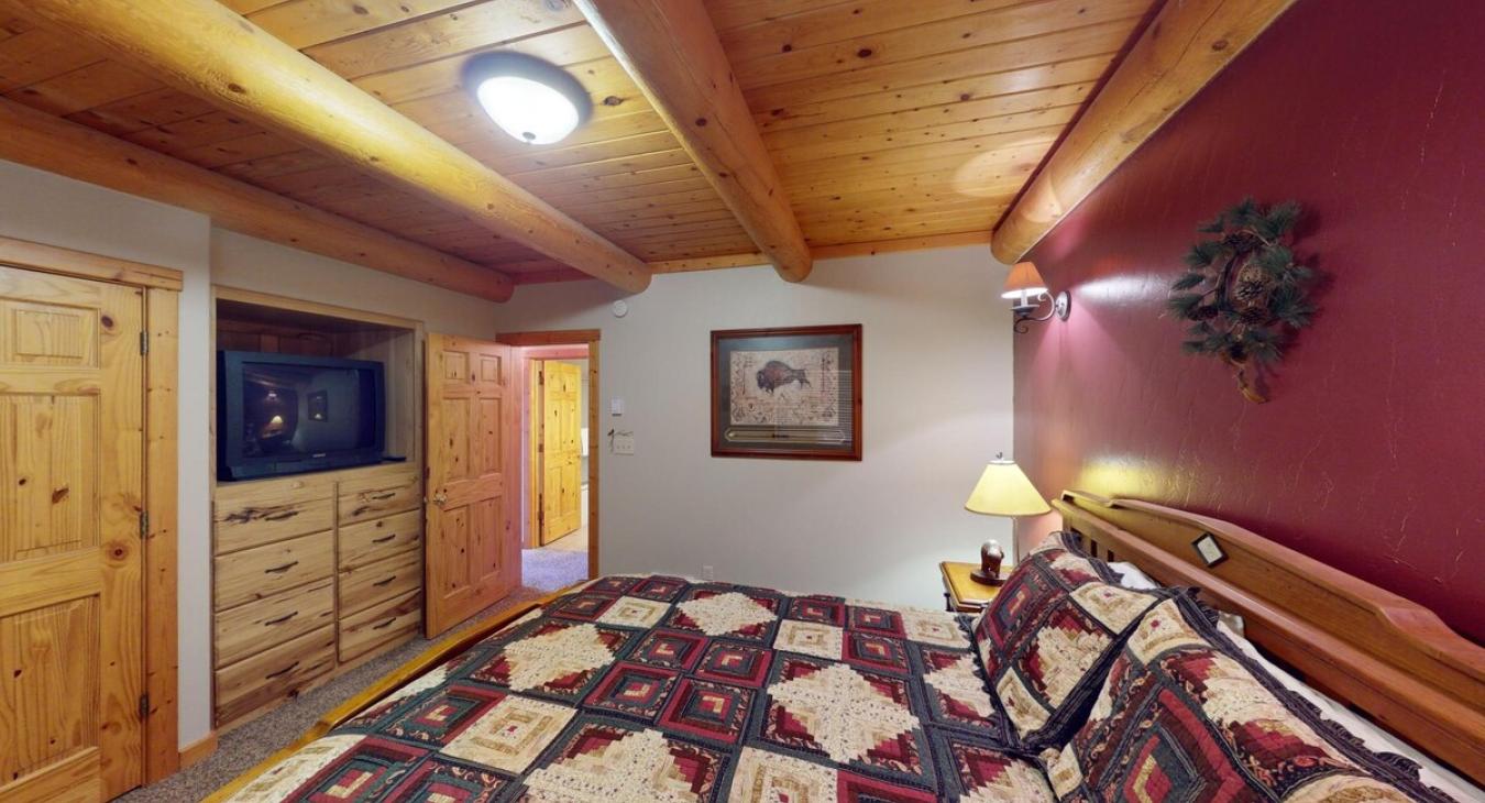 Picture a cozy bedroom in a cabin, where natural materials and soft lighting create a peaceful, retreat-like vibe.