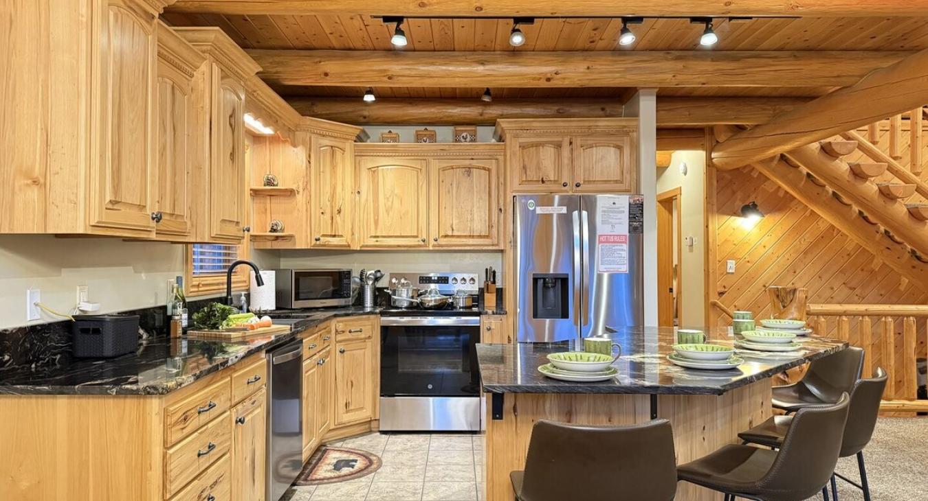 The openness of the kitchen makes it easy to chat with friends or family while cooking, or to catch the glow of the fire and the sound of laughter as you move between the rooms.