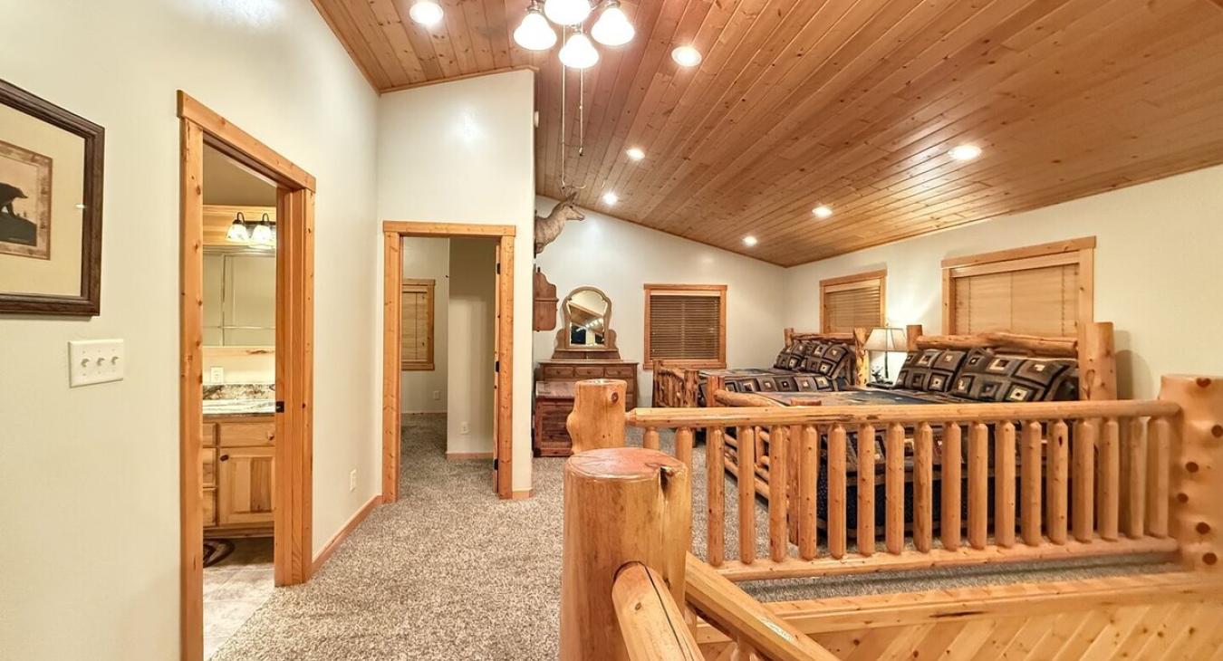 The open concept loft is the ultimate rustic-meets-relaxation space. It’s got that elevated, airy vibe while still feeling super cozy.