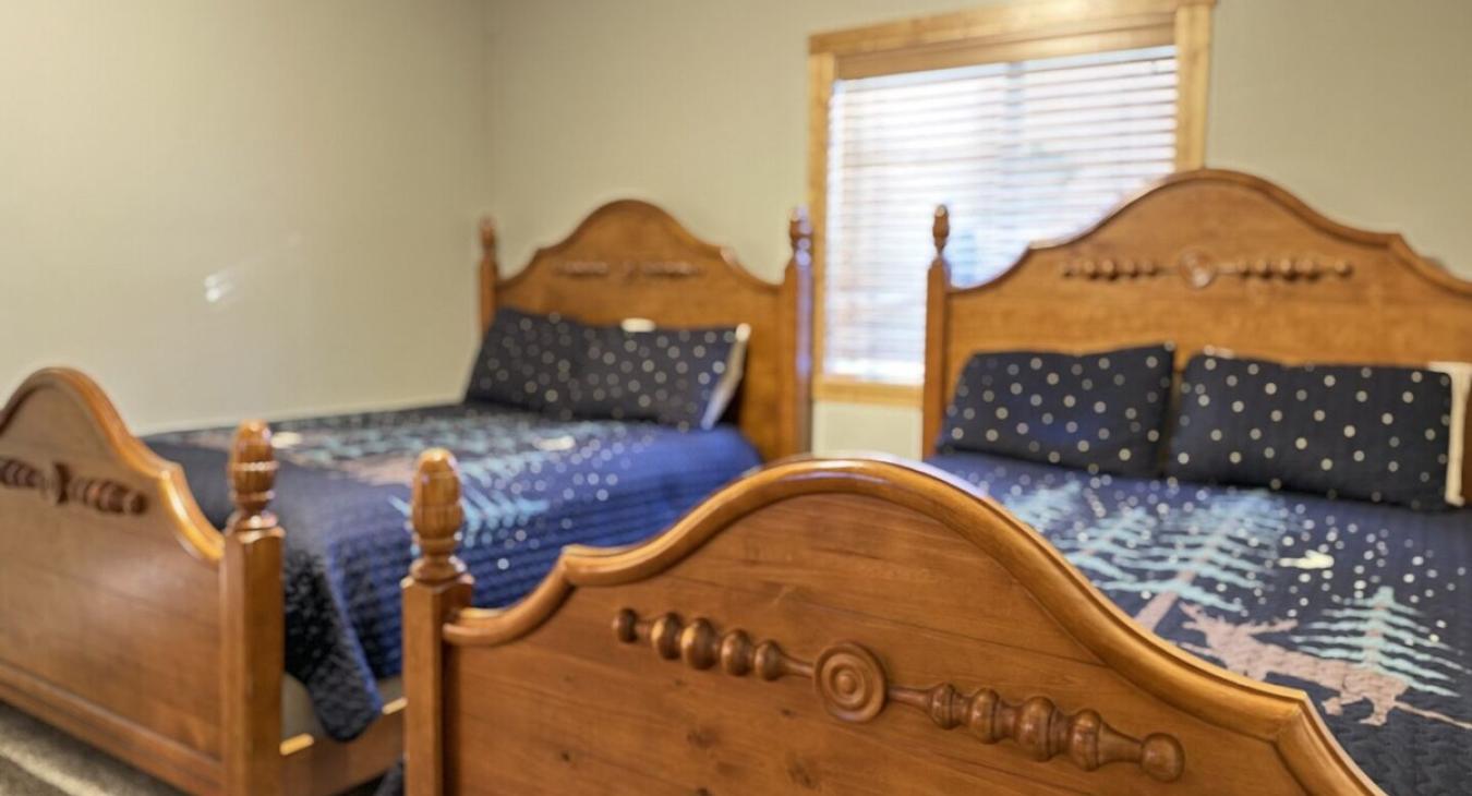 Bedroom #2 located in the basement, equipped with 2 Queen size beds.