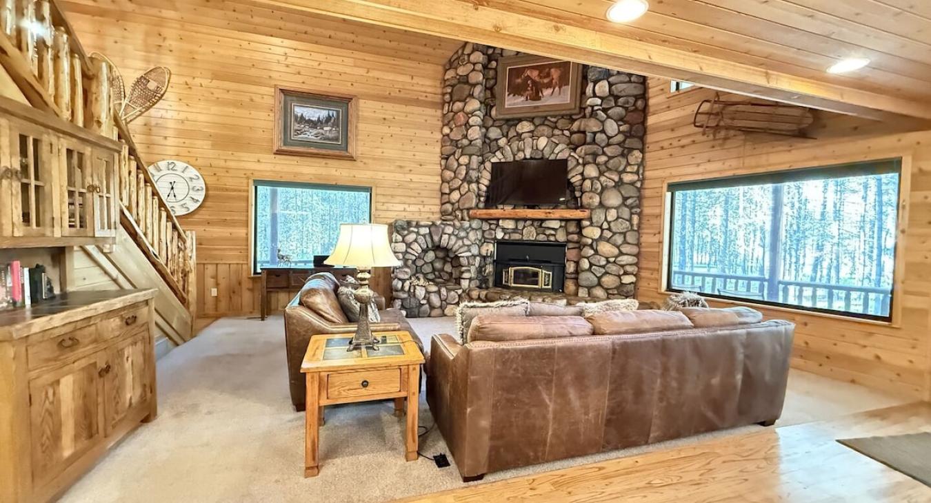 Main level living room with fireplace. Make sure to bring your own firewood.
