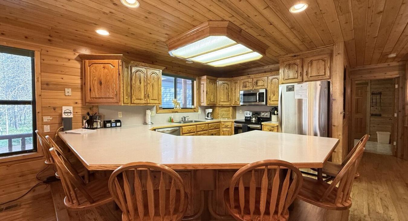 Kitchen located on the main floor. 6 bar stools on the island for additional seating.