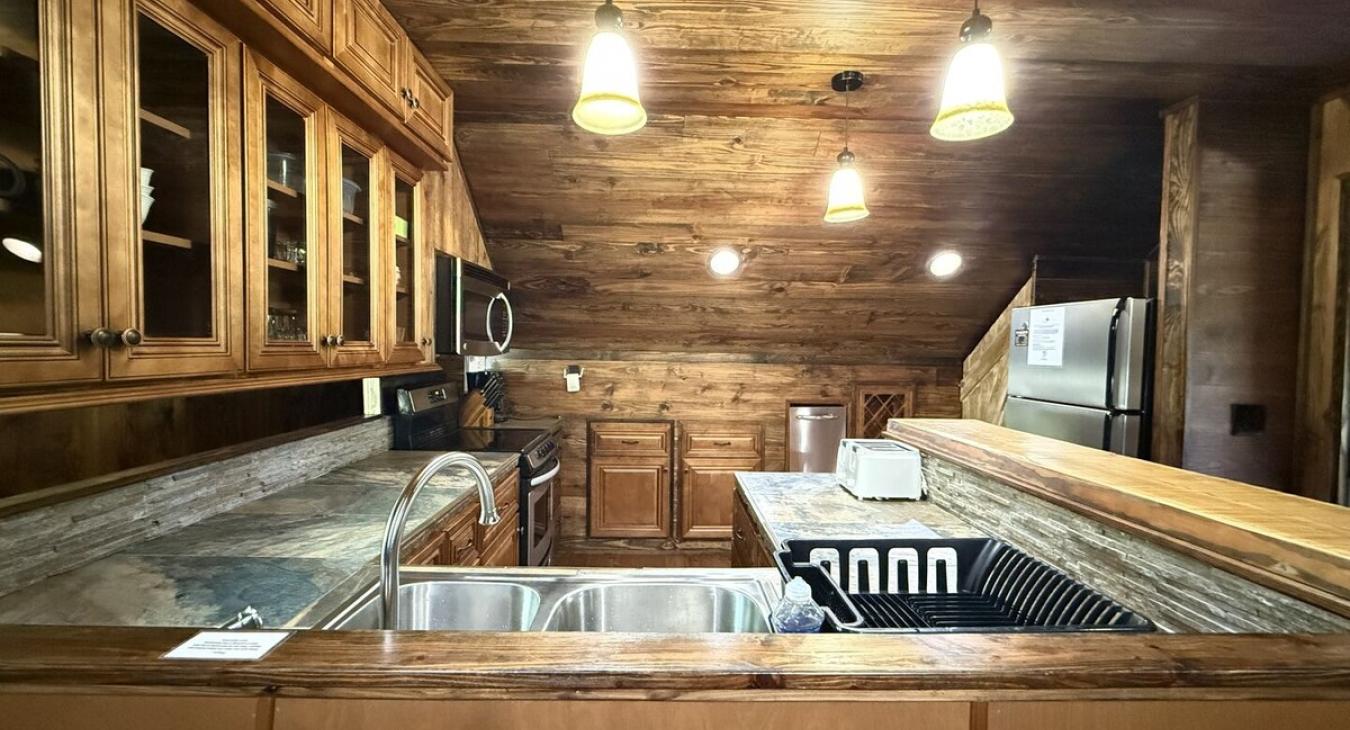 Full size fridge in the kitchen.