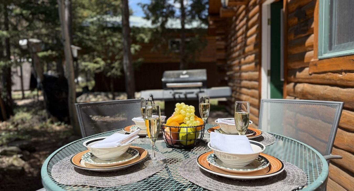 Open deck with a grill and seating.