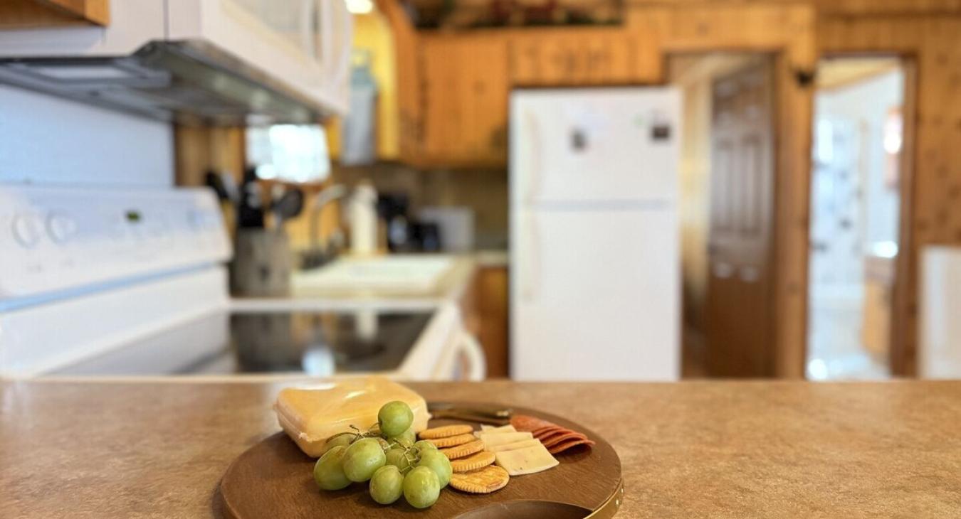 Prepare a home cooked meal in this cozy and fully equipped kitchen.
