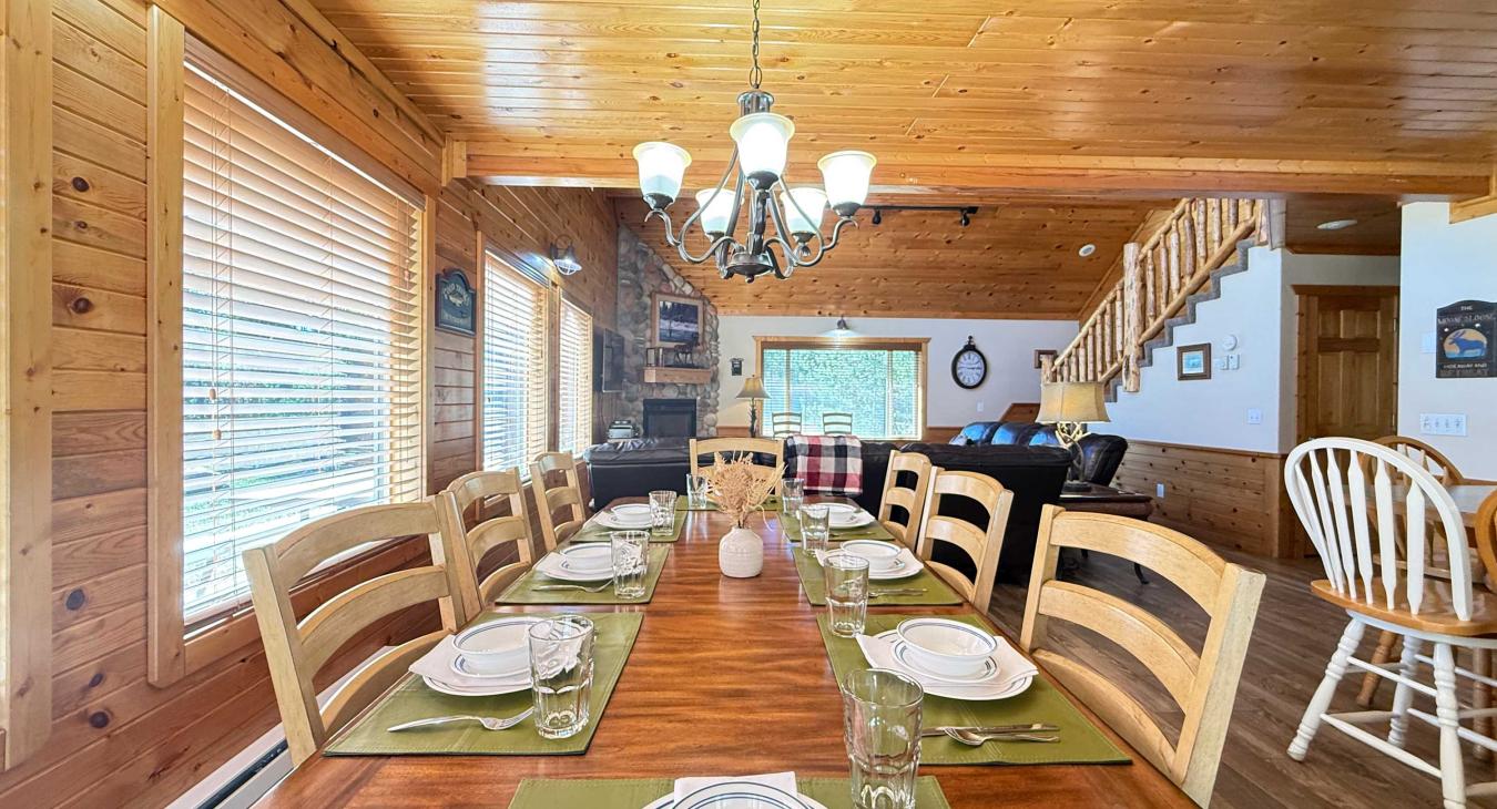 Dining table with seating for up to 8 people with 6 additional seats at the kitchen island.