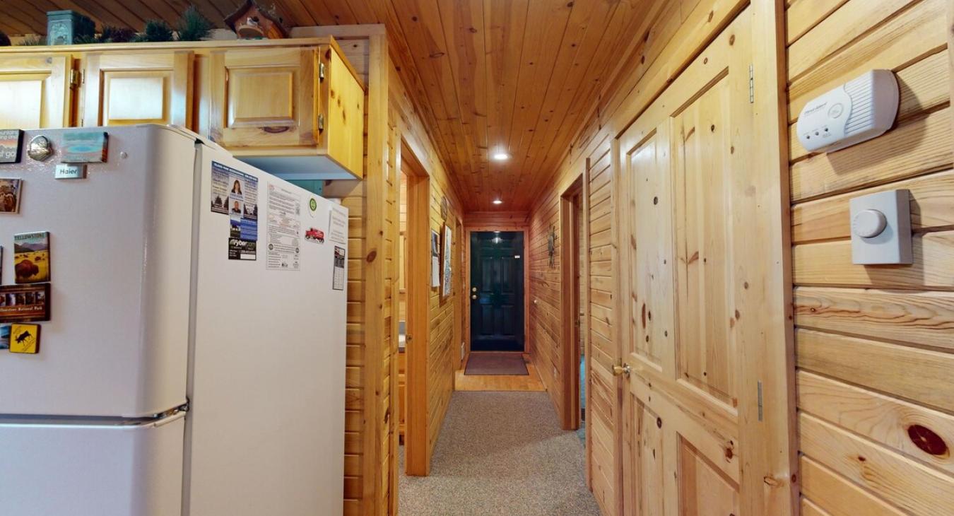 Hallway to access the laundry room, bedroom, bathroom, and entrance.