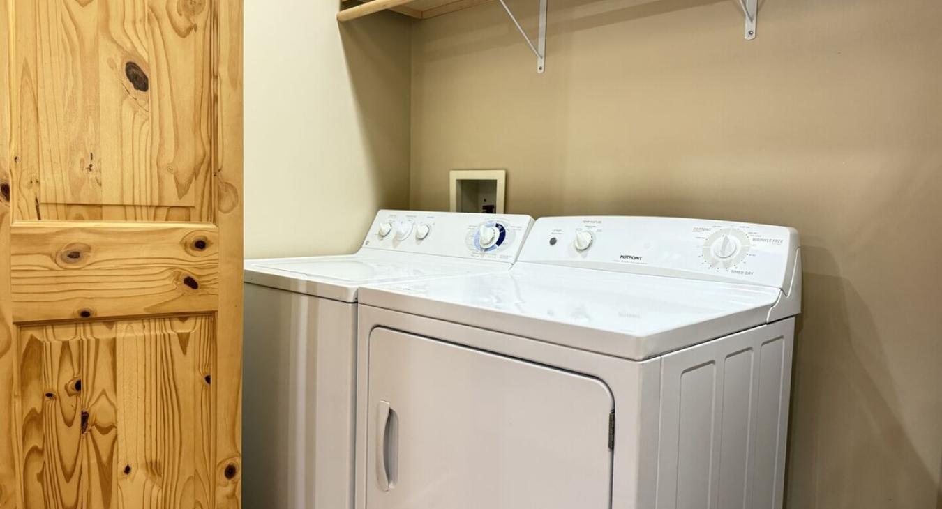 Laundry closet with hangers and closet rod
