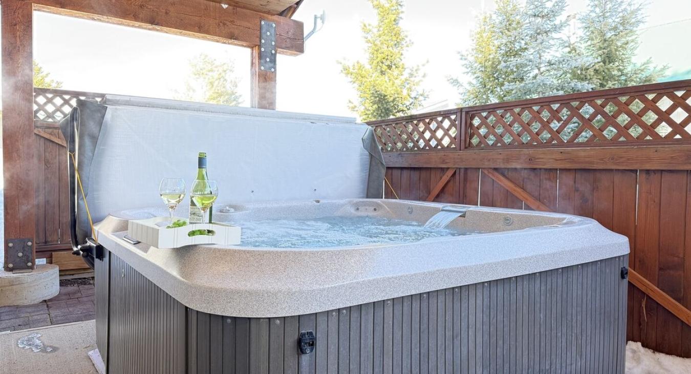 Relax after a long day in the hot tub located through the back door.