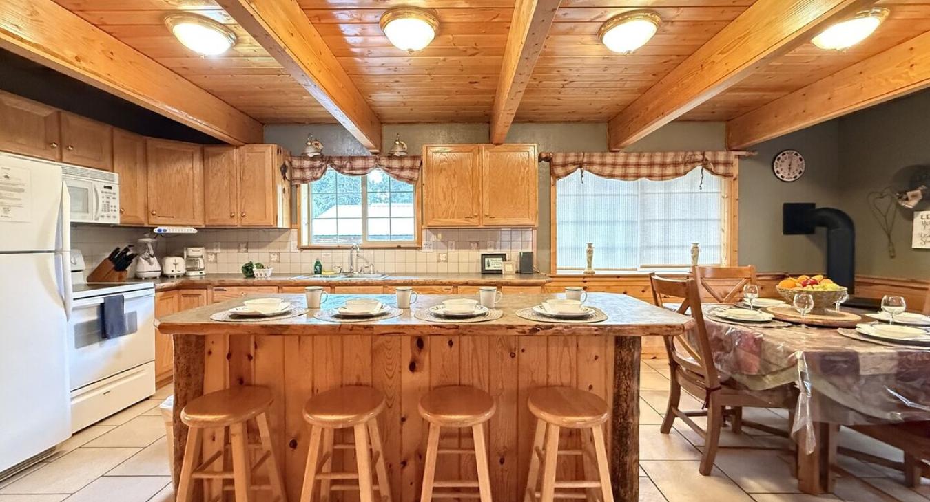 Full size kitchen with appliances, cookware, pots and pans, utensils, dishes, and basic cooking essentials.