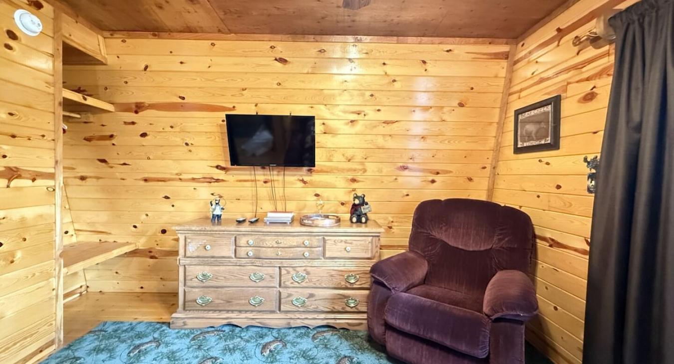 First Bedroom with queen bed and comfortable recliner for some needed relaxation.