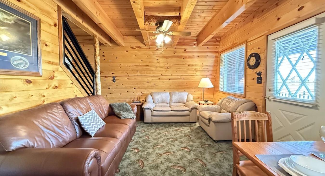Comfortable leather furniture in main living room with mountain views