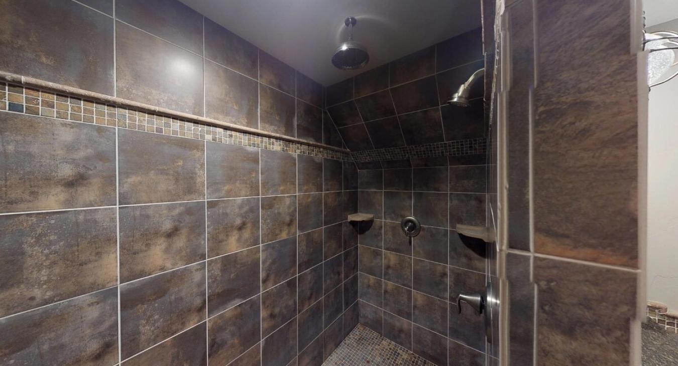 Bathroom on the main floor with a standing walk-in shower.