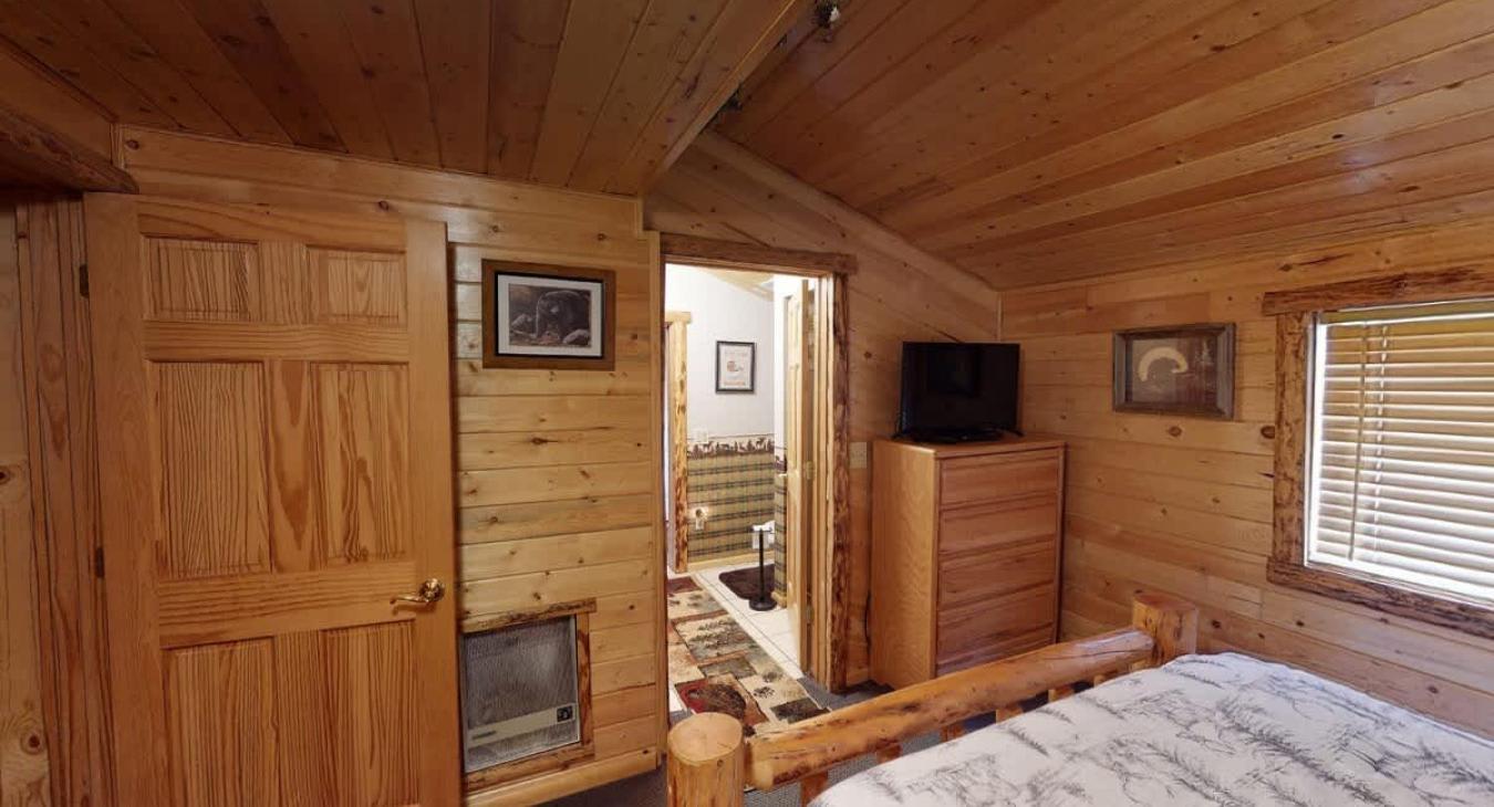 This bedroom is equipped with an ensuite shared bathroom.