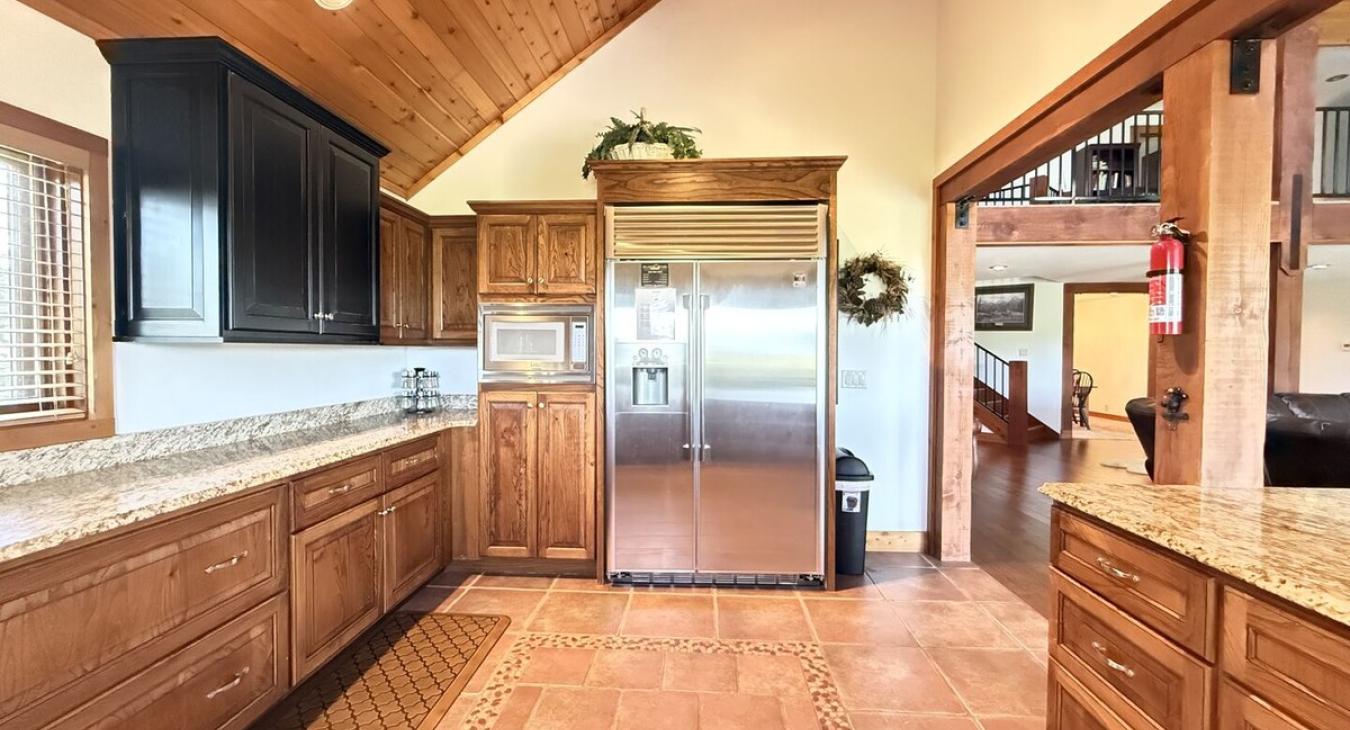 The openness of the kitchen makes it easy to chat with friends or family while cooking, or to catch the glow of the fire and the sound of laughter as you move between the rooms.