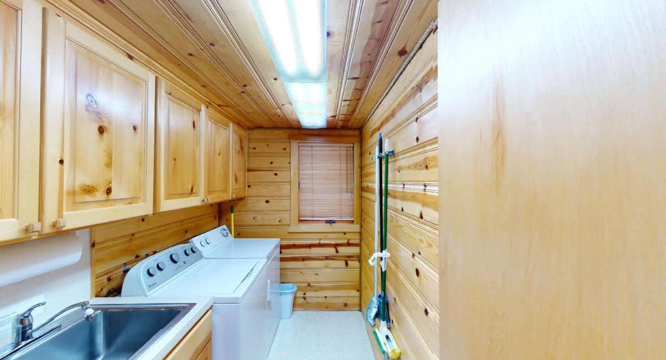 Laundry room with full size washer and dryer. Laundry soap is provided.