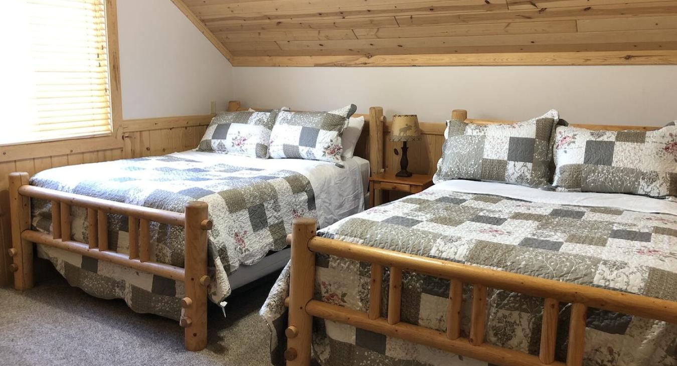 Bedroom #3 located upstairs with 2 Queen beds.