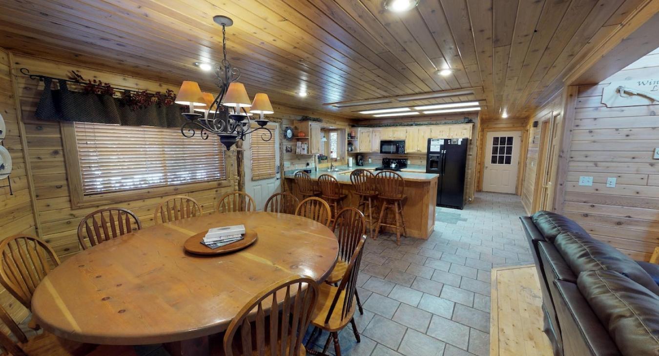 View the kitchen from the dining area with the open concept of the cabin.