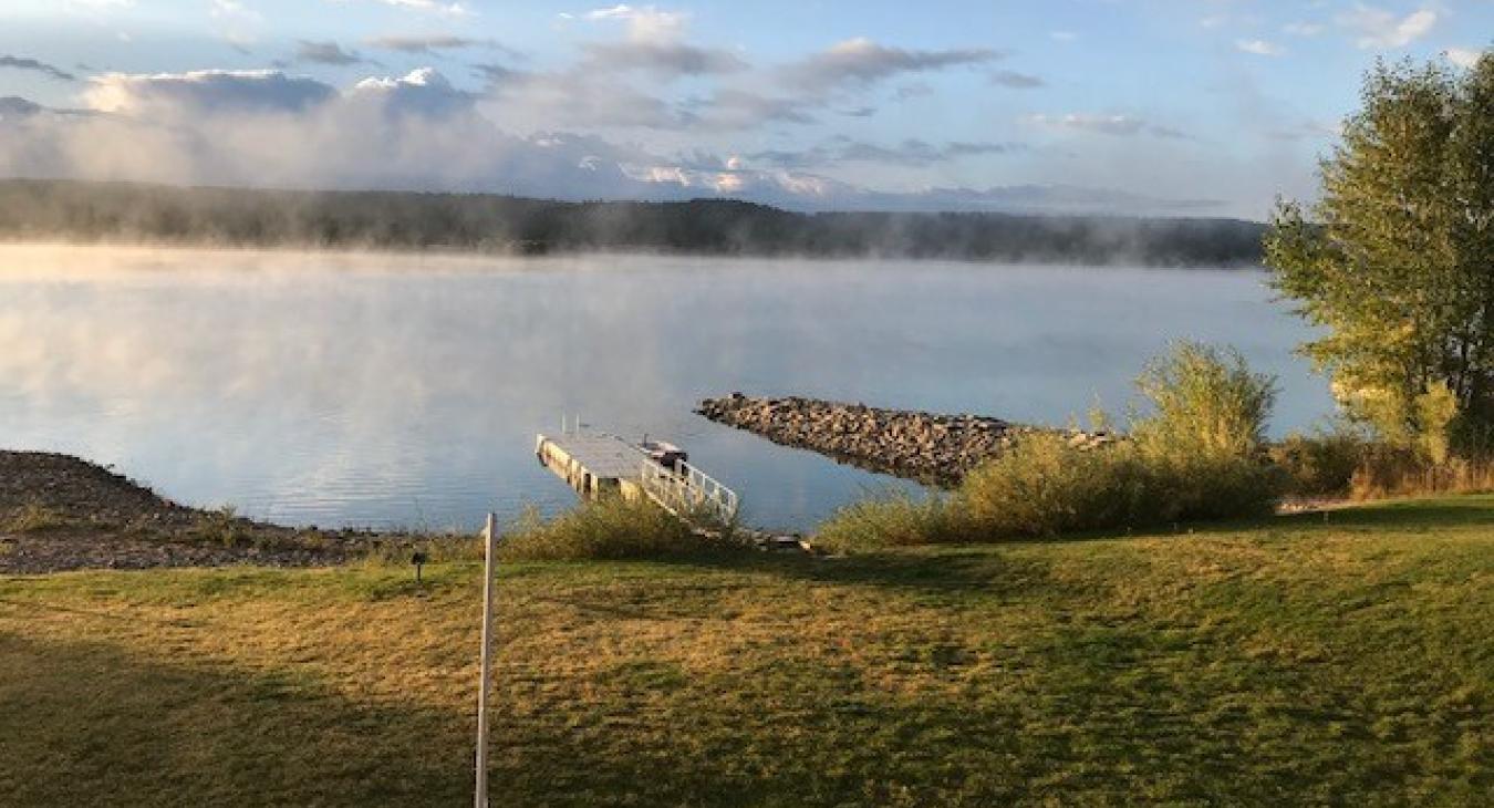 Whether snuggled by a crackling fireplace inside or soaking up sunrise from the deck, the view is an idyllic blend of forest, river, and reservoir — truly Island Park at its finest.