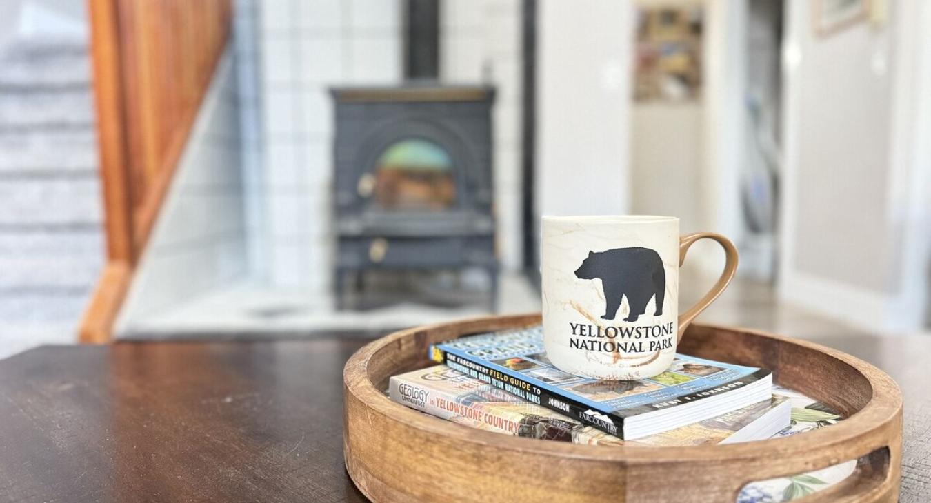 Enjoy your cup of coffee in front of the fireplace.