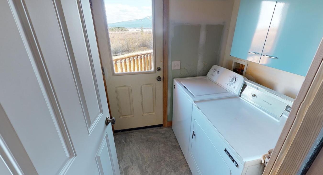 Washer and dryer located in the garage.