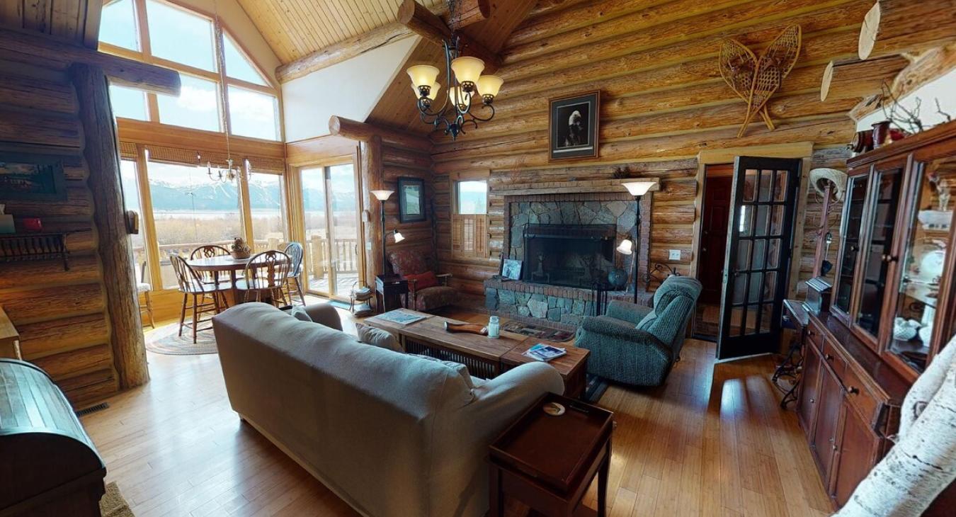 Living room with large open windows illuminating the room.