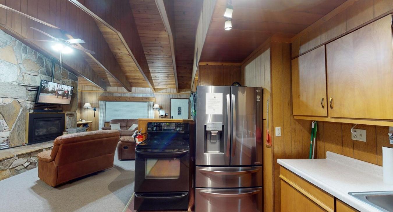 Kitchen with basic appliances and spices.