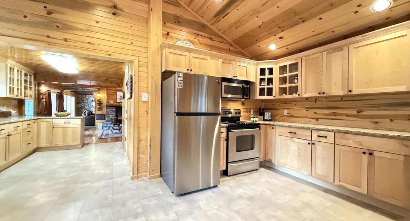 Full kitchen with appliances, cookware, dishes, silverware, and basic cooking spices.