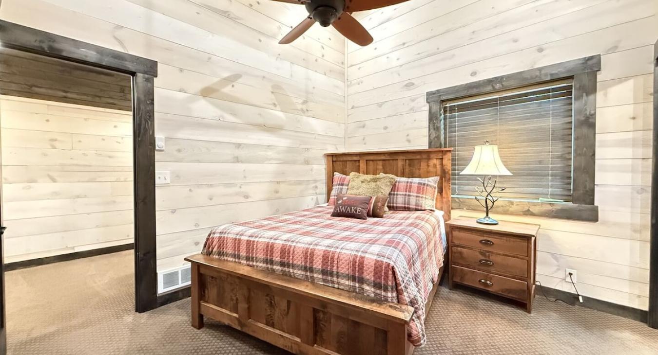 Upstairs private bedroom with queen bed.