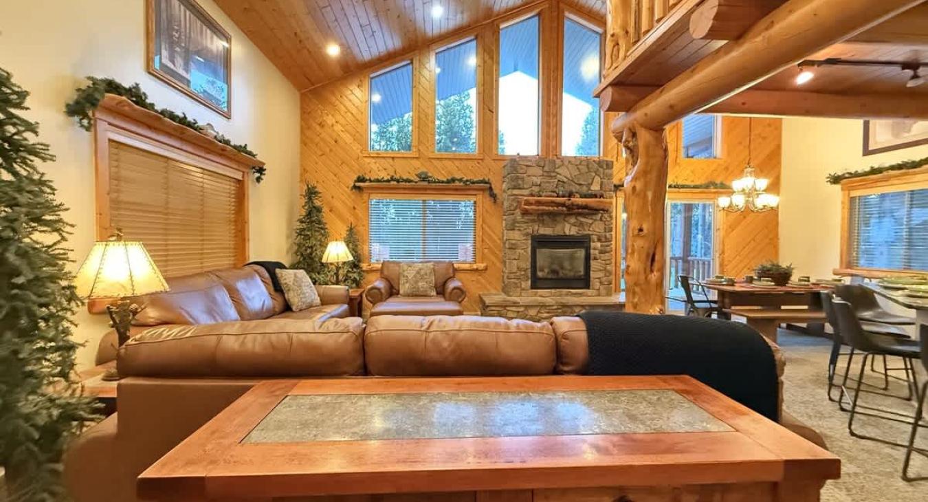 Natural light pours in through large windows, tying it all together with a view of the forest just beyond.