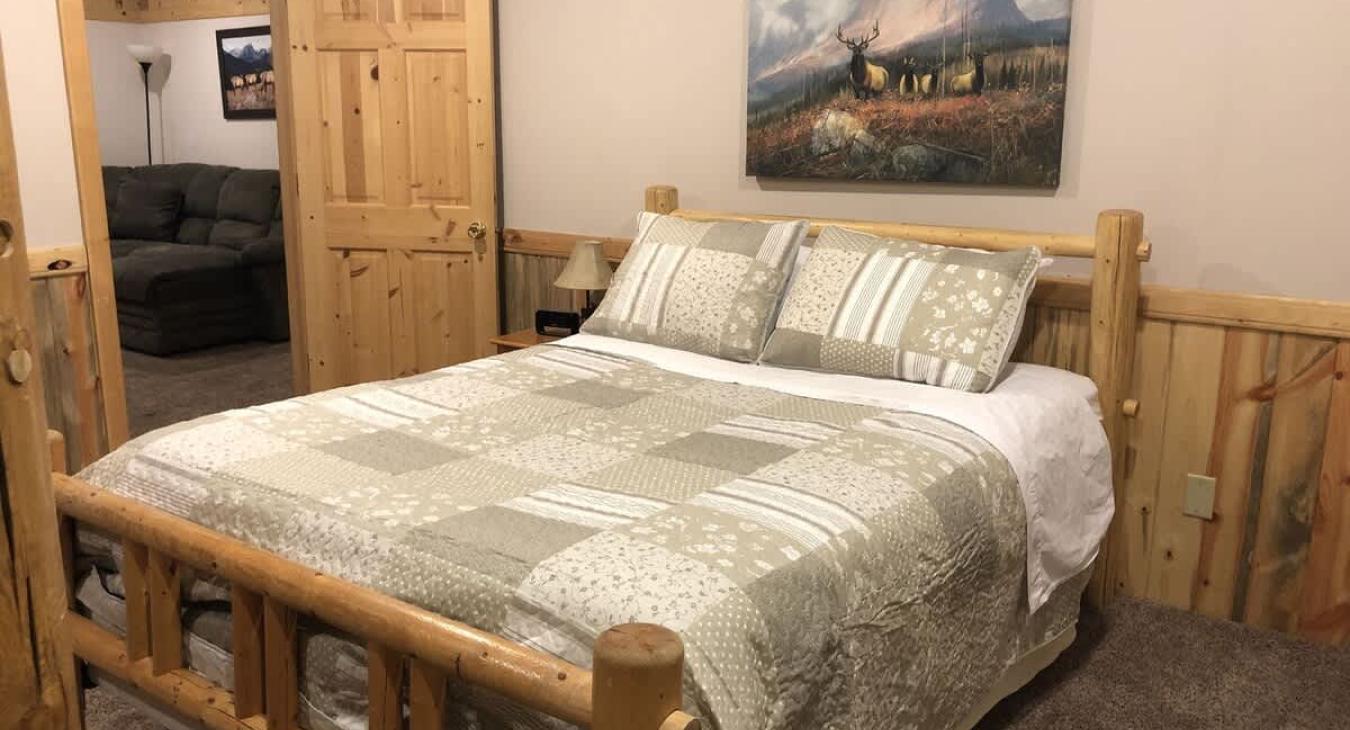 Bedroom #8 located downstairs with a Queen and a bunkbed.