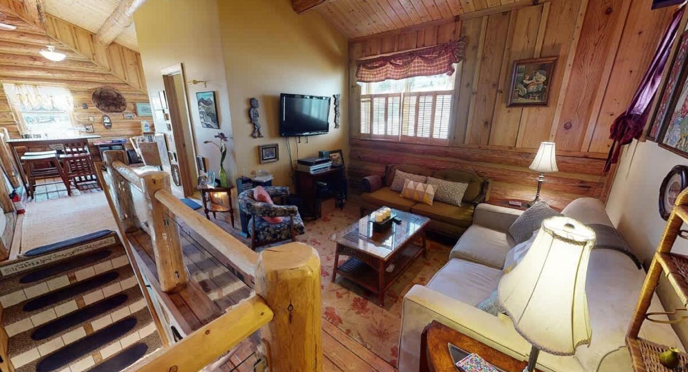 Upstairs living are with seating and tv for entertainment.